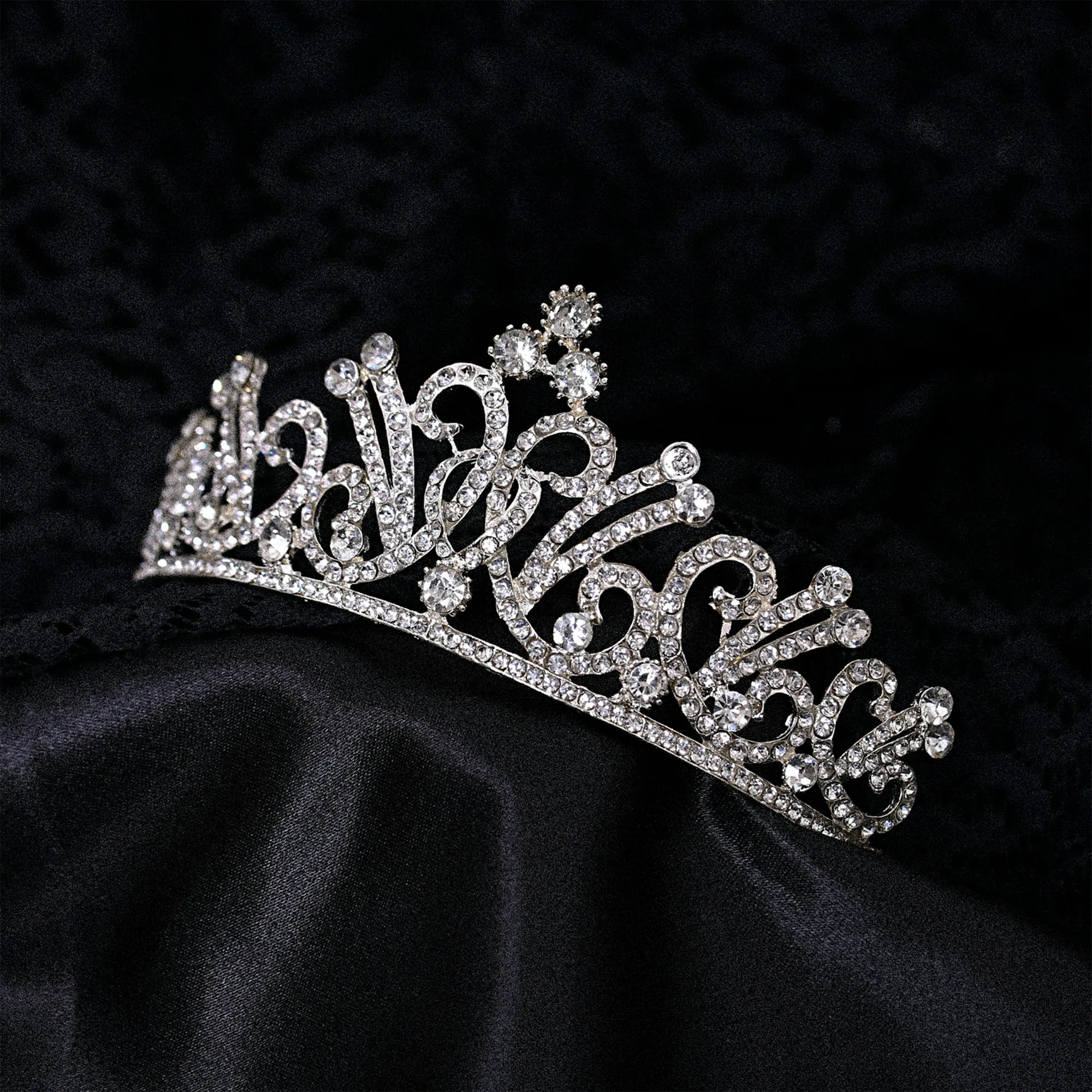 Rhinestone tiara on black satin