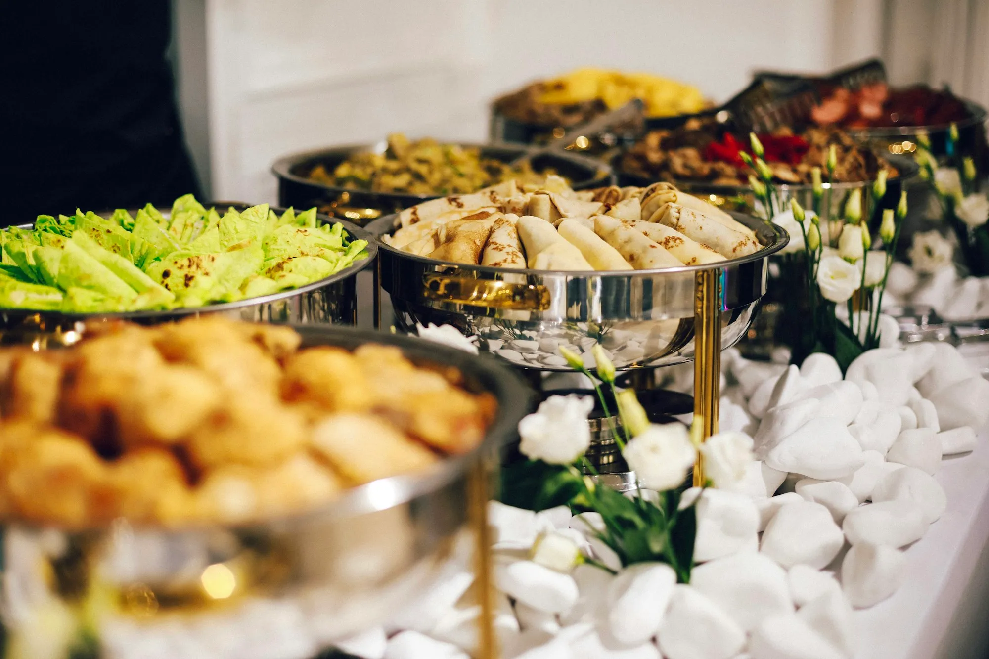 Buffet table set with gold chafing dishes