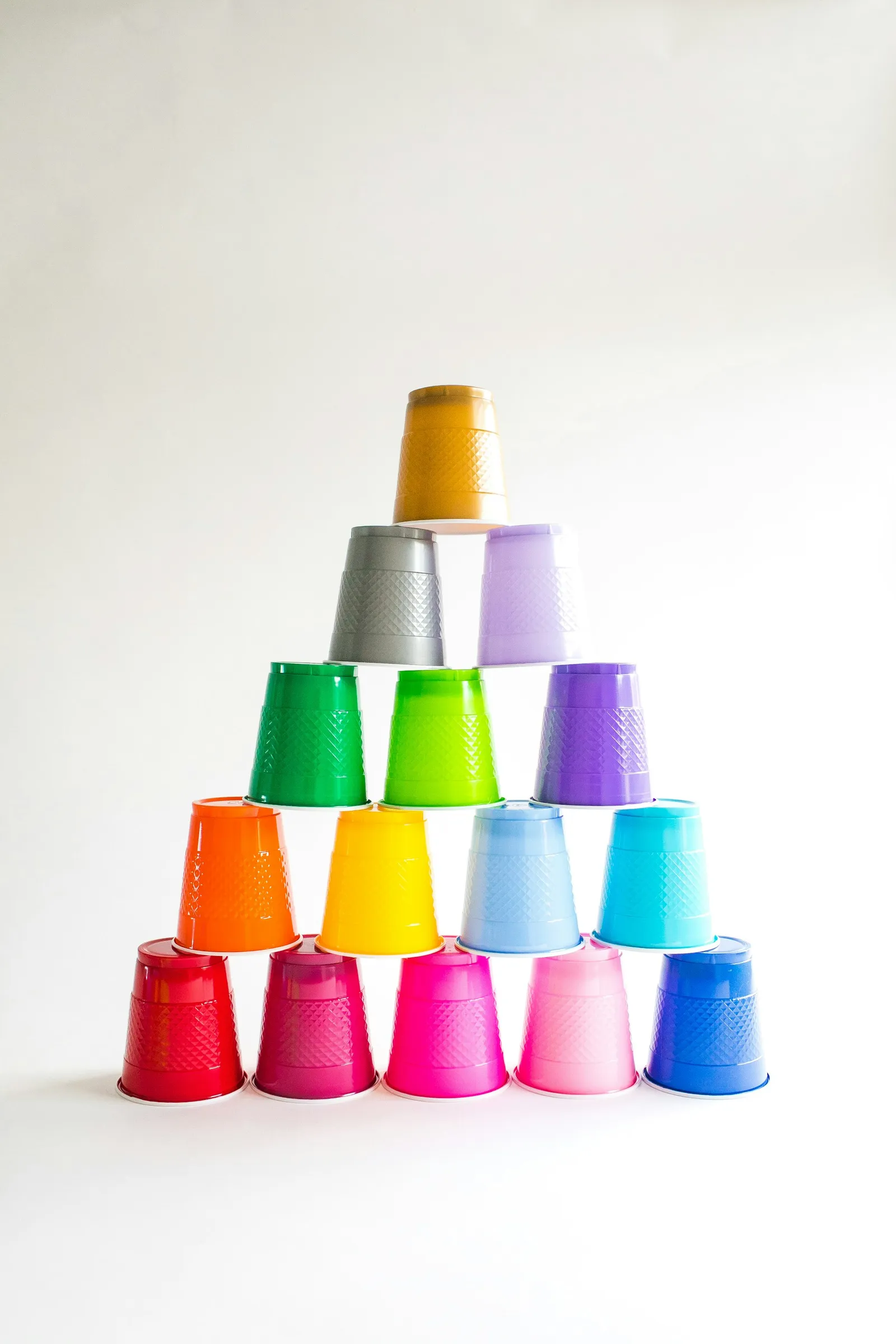Pyramid of plastic cups in solid colors